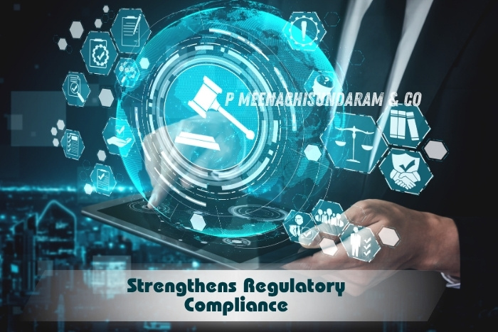 Professionals reviewing financial data with a calculator and during a concurrent audit P Meenachisundaram & Co in Coimbatore